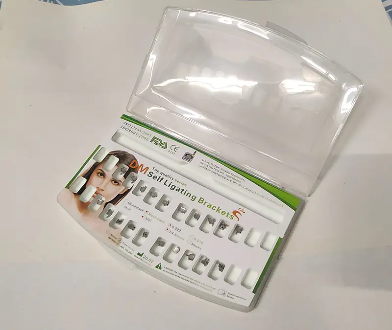 SELF-LIGATING BRACKET MESH BASE,METAL. - Master